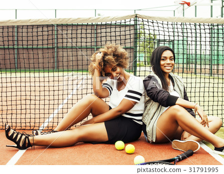 young pretty girlfriends hanging on tennis court young pretty girlfriends hanging on tennis court 31791995