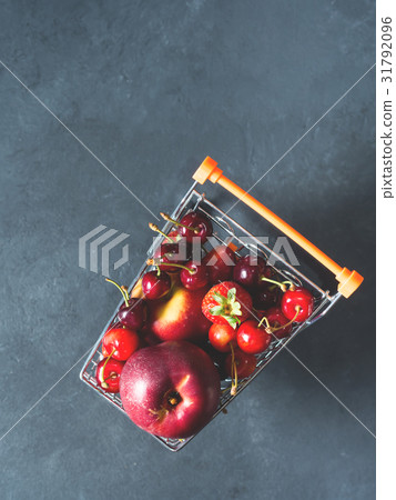 Fresh red fruit berries supermarket cart on black Fresh red fruit berries supermarket cart on black 31792096