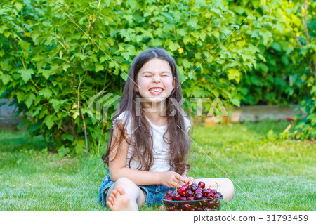 girl eating a sweet cherry girl eating a sweet cherry 31793459