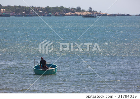 nautical fishing coracles in sea, tribal boats nautical fishing coracles in sea, tribal boats 31794019