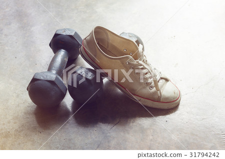 sport shoe and metal dumbbell, fitness sport 31794242