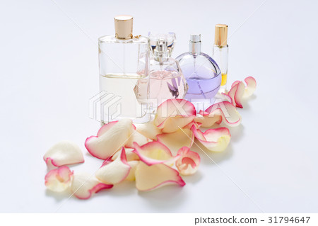 Perfume bottles with flower petals on light Perfume bottles with flower petals on light 31794647