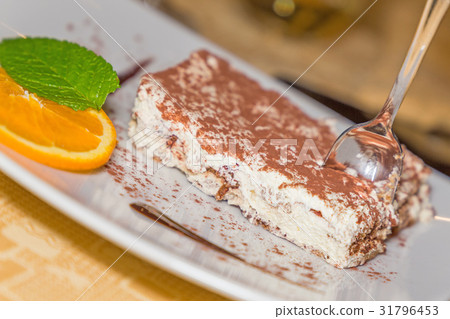 A portion of tiramisu cake A portion of tiramisu cake 31796453