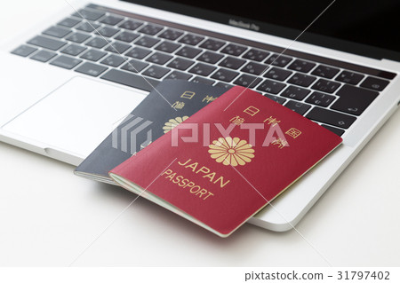 Passport and laptop computer Passport and laptop computer 31797402