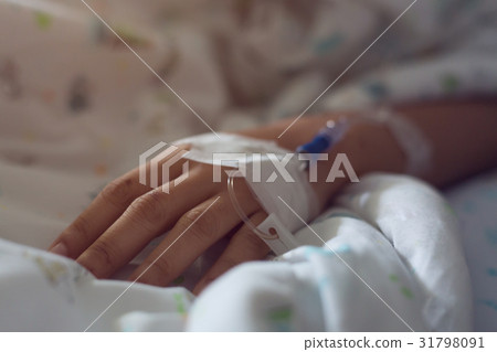 medical infusion iv drip saline solution in hand 31798091