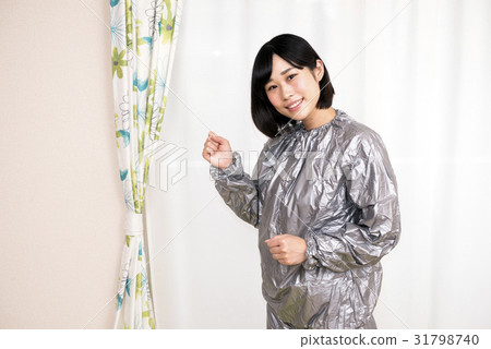 A woman in a sauna suit 31798740