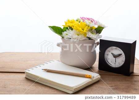 Work space with notebook,alarm clock Work space with notebook,alarm clock 31799489