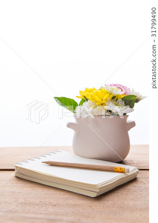 Notebook and beautiful pink carnation flowers Notebook and beautiful pink carnation flowers 31799490