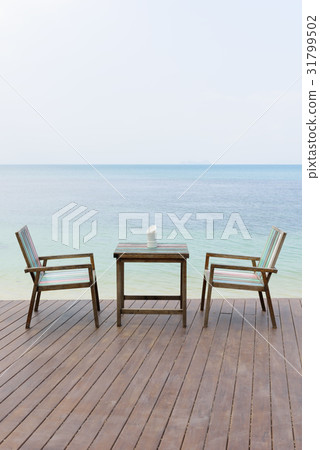 Wooden vintage table set with blue sky and sea Wooden vintage table set with blue sky and sea 31799502