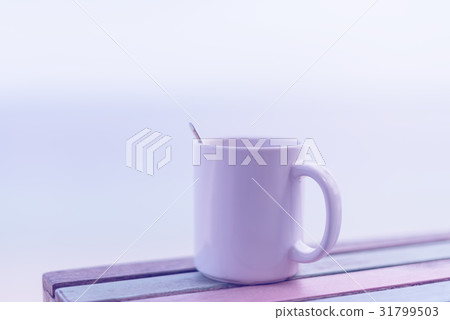 cup of coffee on wooden table with retro filter cup of coffee on wooden table with retro filter 31799503