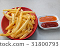 Fries potatoes with tomato and chili sauce. 31800793