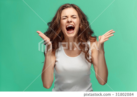 Portrait of young woman with shocked facial 31802084