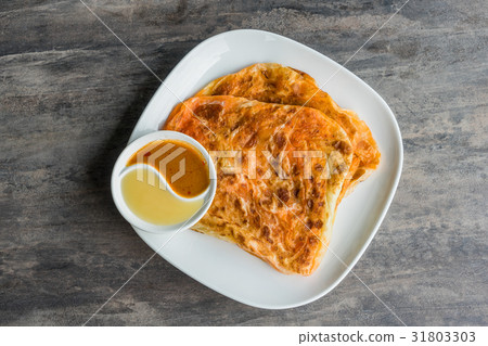 Indian Roti Prata with Condensed milk and Curry Indian Roti Prata with Condensed milk and Curry 31803303