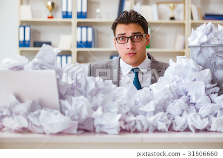 Businessman in paper recycling concept in office 31806660