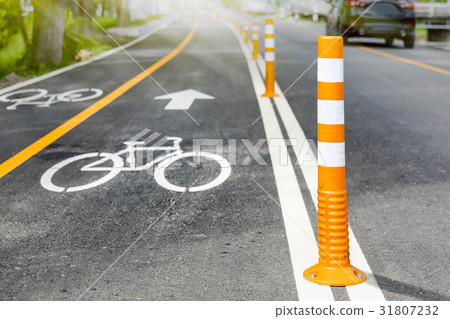 Flexible traffic bollard for bike lane. 31807232