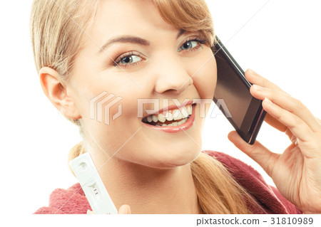 Smiling woman with mobile phone 31810989