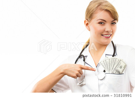 Woman doctor with stethoscope showing dollar 31810991