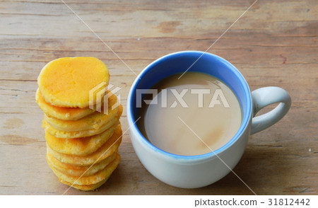 milk coffee and little pancake on table 31812442