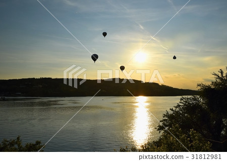 Colorful hot air balloon is flying at sunset.Brno Colorful hot air balloon is flying at sunset.Brno 31812981