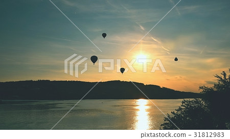 Colorful hot air balloon is flying at sunset.Brno Colorful hot air balloon is flying at sunset.Brno 31812983