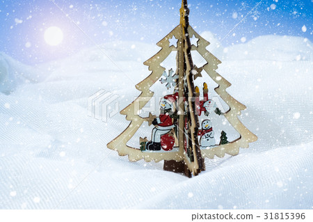 wood snowman on the Christmas tree with light and wood snowman on the Christmas tree with light and 31815396