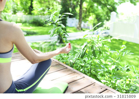 Young woman doing yoga asana in moning outdoors Young woman doing yoga asana in moning outdoors 31815809