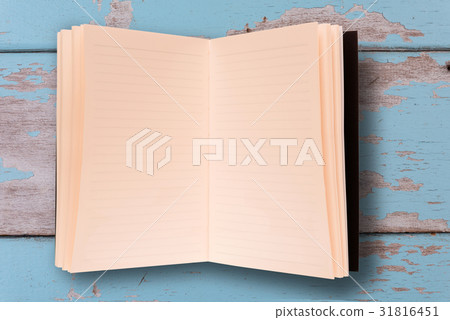 Top view of old notebook on grunge blue wood board 31816451
