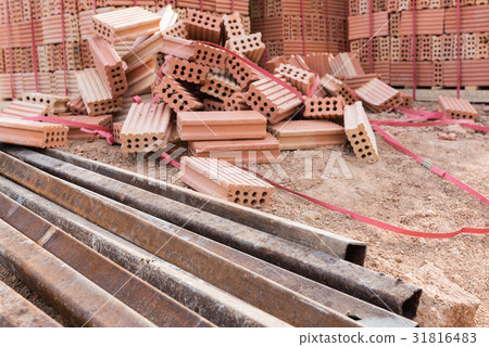Rusty steel beam and brick on construction site Rusty steel beam and brick on construction site 31816483