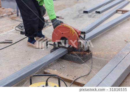 Close-up worker using a hand circular saw  31816535