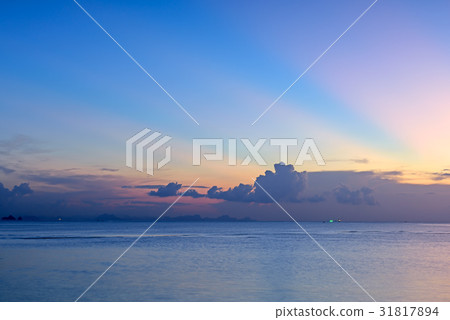 Beautiful sunset with blue sea and sky background Beautiful sunset with blue sea and sky background 31817894