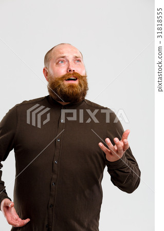 Man in shirt looks up Man in shirt looks up 31818555