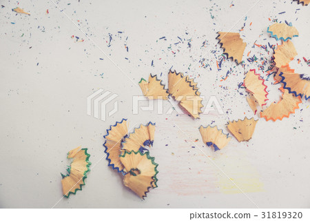 Color pencil shaves on a white paper, warm tone Color pencil shaves on a white paper, warm tone 31819320