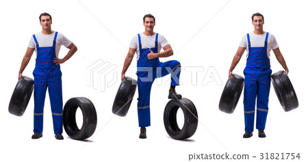Handsome tyre repairman isolated on white 31821754