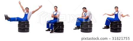 Handsome tyre repairman isolated on white Handsome tyre repairman isolated on white 31821755