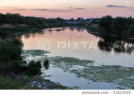 Sunset Mertvovid riverbank in Voznesensk, Ukraine. Sunset Mertvovid riverbank in Voznesensk, Ukraine. 31823420