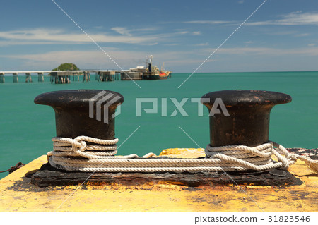 Black old bollard with ropes Black old bollard with ropes 31823546