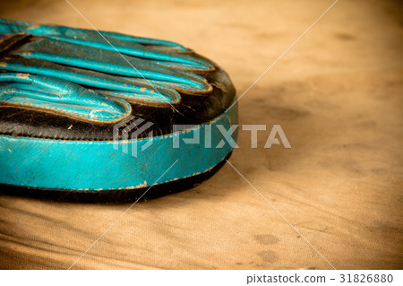 Old red boxing gloves on canvas 31826880