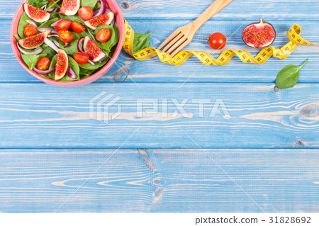Fruit and vegetable salad, fork with tape measure Fruit and vegetable salad, fork with tape measure 31828692
