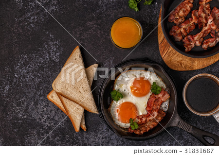 Breakfast with bacon , fried egg, coffee Breakfast with bacon , fried egg, coffee 31831687