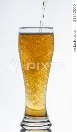 Light beer pours into a glass Light beer pours into a glass 31832060