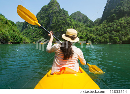 Girl kayaking on seaside of Halong bay in Vietnam 31833234