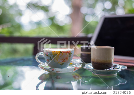 Beautiful cup of hot drink with coffee Beautiful cup of hot drink with coffee 31834056