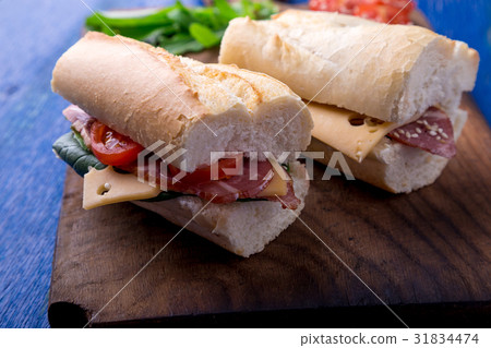 Sandwich with jamon, arugula, tomatoes, cheese Sandwich with jamon, arugula, tomatoes, cheese 31834474