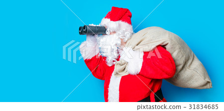 Funny Santa Claus have a fun with binoculars 31834685