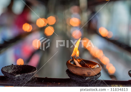 Coconut oil lamps in temple 31834813