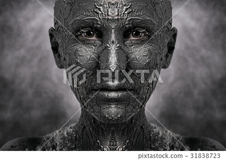 Symmetrical terrible face with cracked skin 31838723