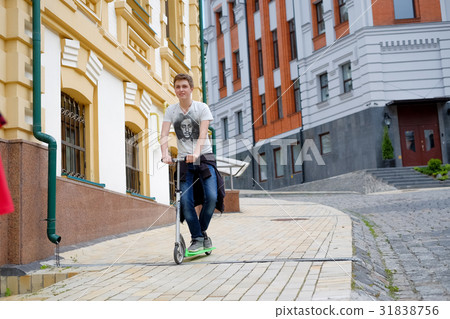 happy boy travel on kick scooter happy boy travel on kick scooter 31838756