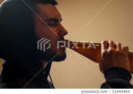 Cropped shot of male adult drinking beer 31840464