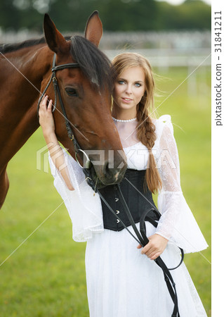 Beautiful woman with chestnut horse Beautiful woman with chestnut horse 31841211