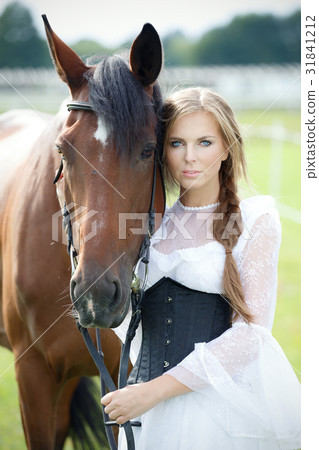Beautiful woman with chestnut horse Beautiful woman with chestnut horse 31841212